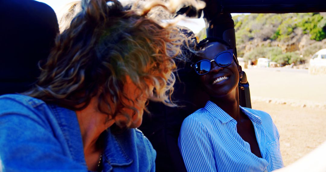 Friends Laughing and Enjoying a Road Trip in a Convertible Car - Free Images, Stock Photos and Pictures on Pikwizard.com