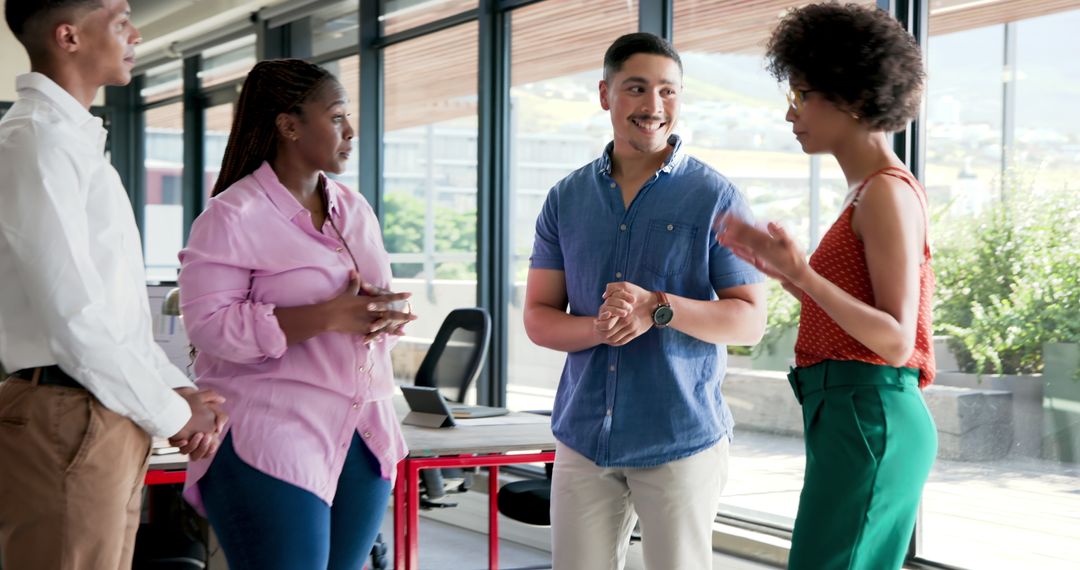 Diverse Colleagues Engaging in Teamwork in Modern Office