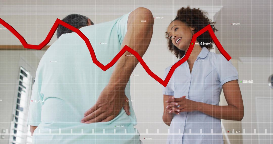 Senior patient holding lower back while consulting clinician with red chart overlay