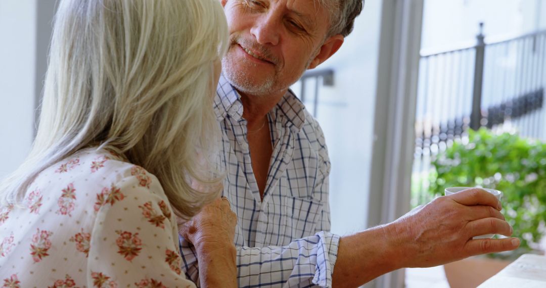 Senior Couple Sharing Tender Moment in Living Room