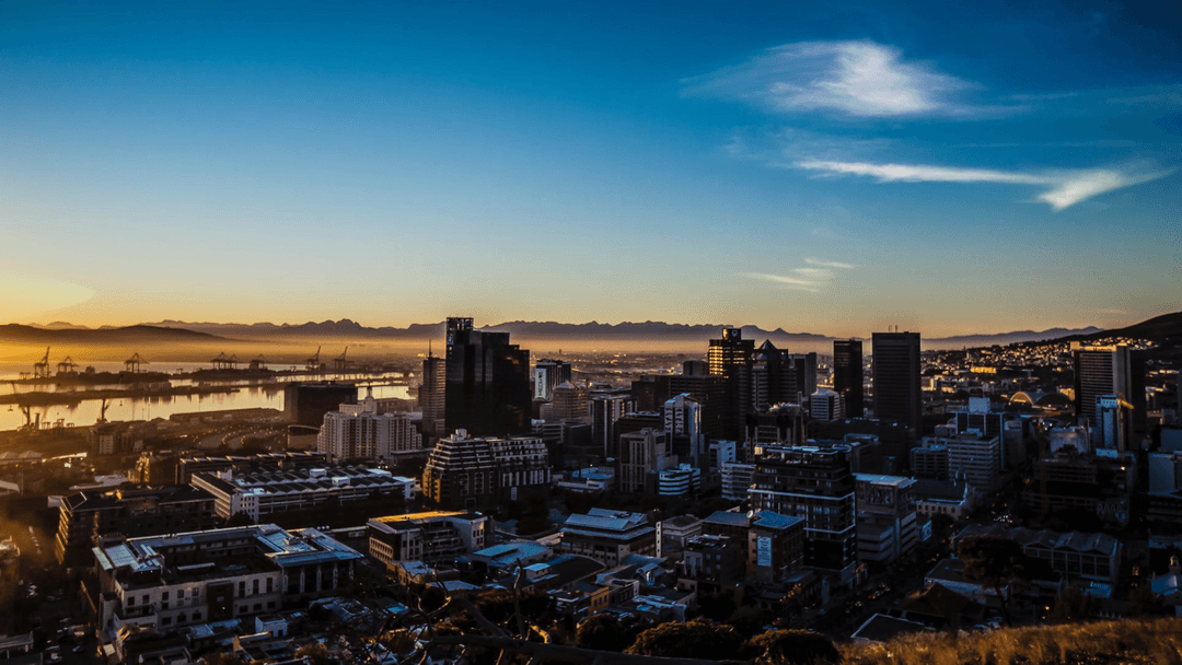 Transparent Sunlit City Skyline Overlooking Harbor at Dusk