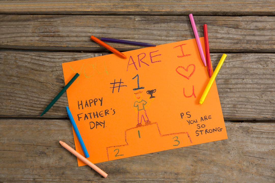 Handmade Father's Day Card with Crayons on Wooden Table - Free Images, Stock Photos and Pictures on Pikwizard.com