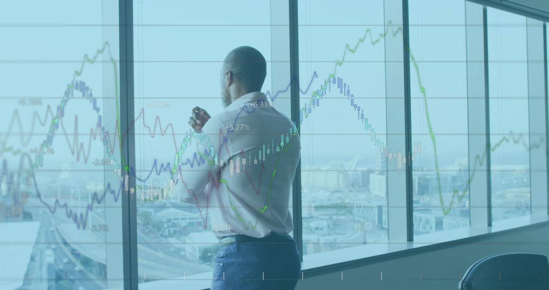 Businessman Analyzing Financial Data with City View