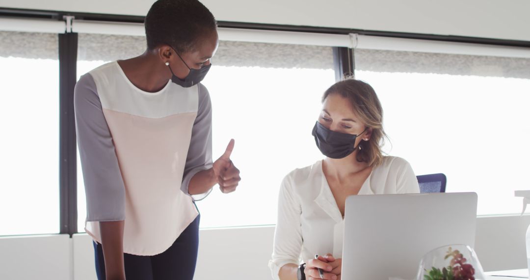 Coworkers Collaborating in Modern Office Wearing Face Masks - Free Images, Stock Photos and Pictures on Pikwizard.com