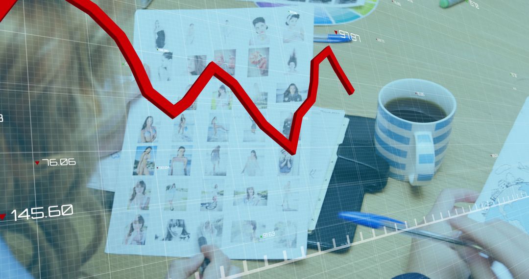 Analyzing Market Trends During Office Meeting with Coffee and Photos - Free Images, Stock Photos and Pictures on Pikwizard.com