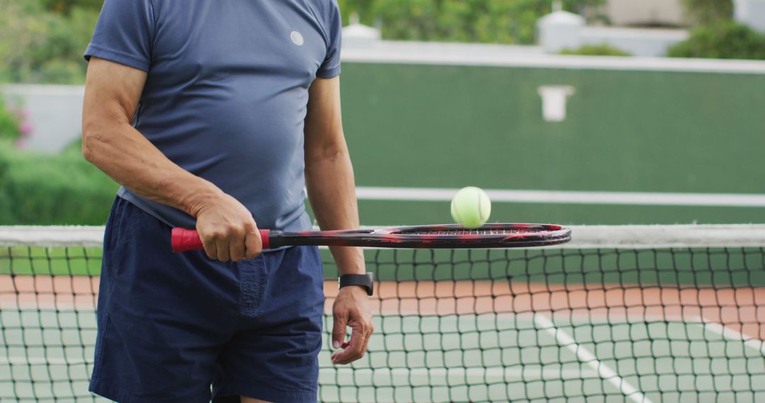 Man Preparing for Tennis Game Holding Racket and Ball on Court - Free Images, Stock Photos and Pictures on Pikwizard.com