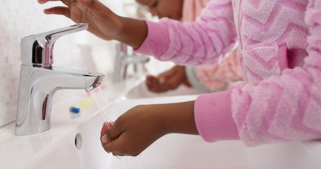 Children Washing Hands by Bathroom Sink - Free Images, Stock Photos and Pictures on Pikwizard.com