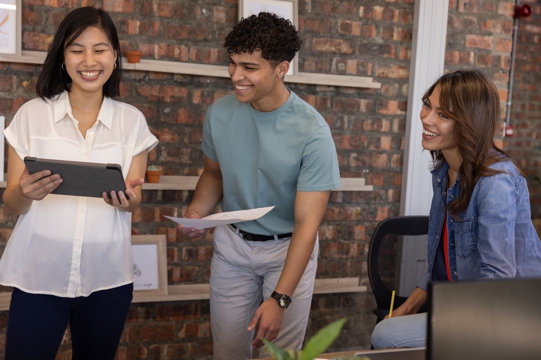 Diverse Coworkers Engaging in Creative Office Collaboration