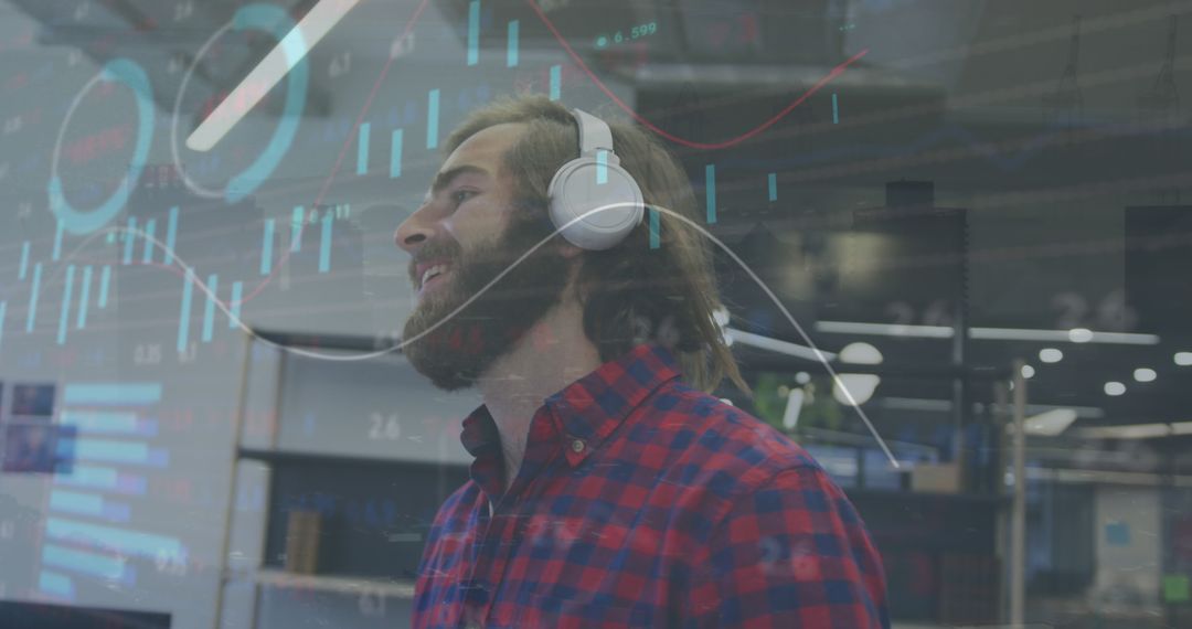 Smiling Man with Headphones Analyzing Data on Computer Screen in Office - Free Images, Stock Photos and Pictures on Pikwizard.com