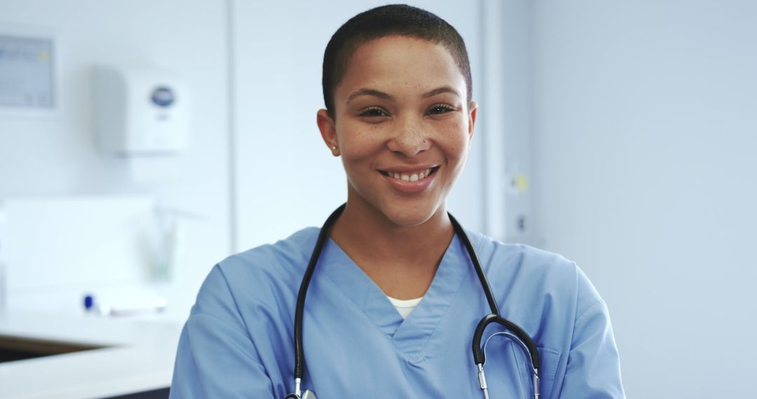 Smiling Nurse in Blue Scrubs with Stethoscope in Medical Office - Free Images, Stock Photos and Pictures on Pikwizard.com