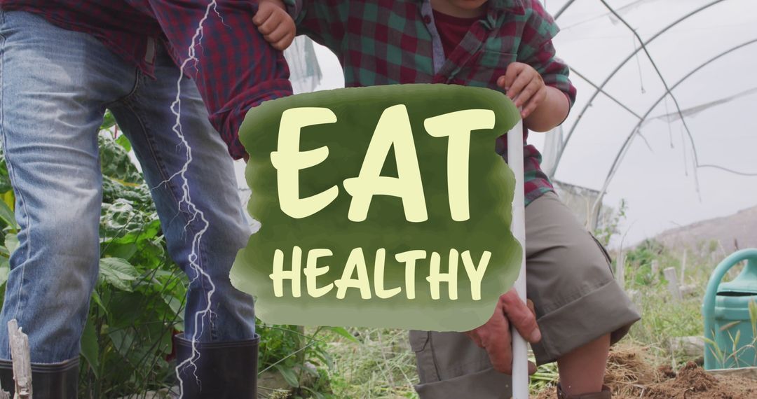 Father Teaching Son Sustainable Farming Techniques in Greenhouse