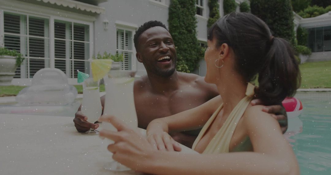 Couple Relaxing by the Poolside with Refreshing Cocktails