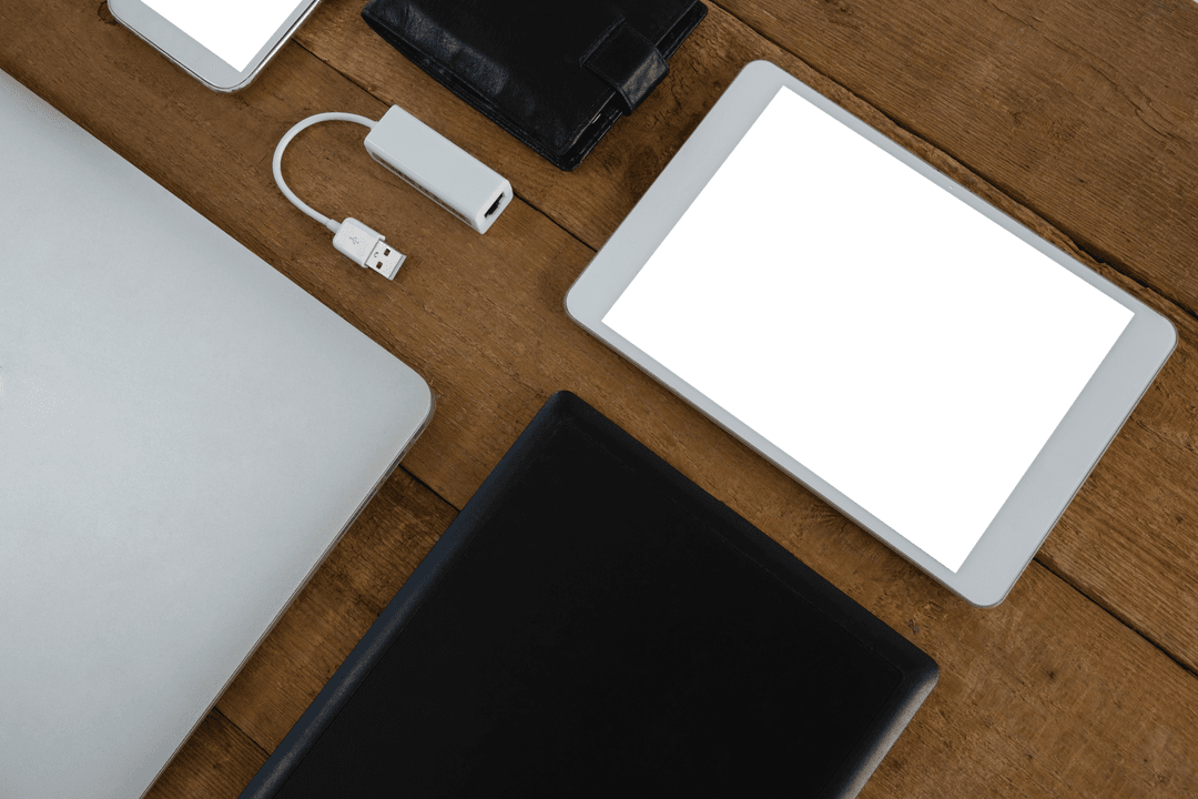 Transparent Gadgets Compactly Arranged on Wooden Surface