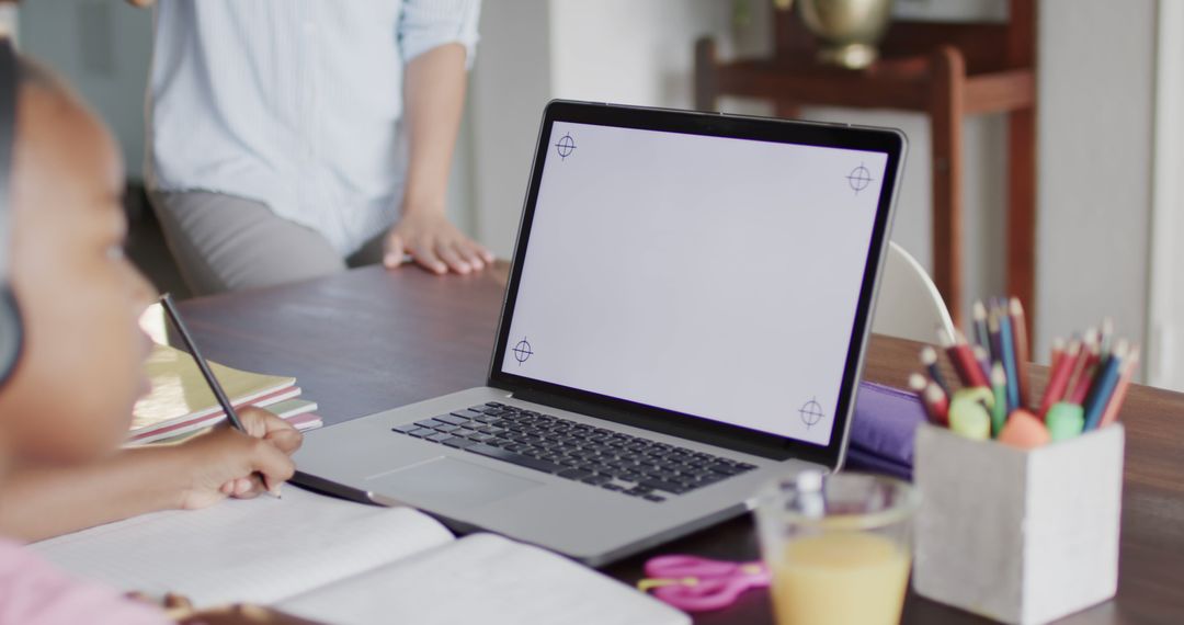 Young Student Engaged in Online Learning with Laptop at Home