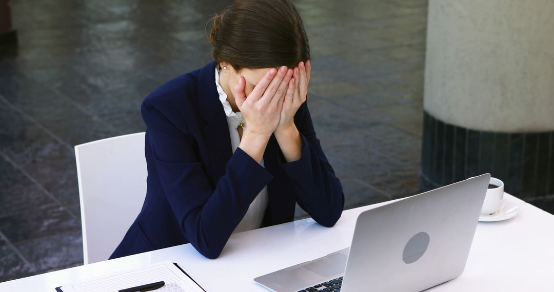 Frustrated Businesswoman Covering Face at Desk - Free Images, Stock Photos and Pictures on Pikwizard.com