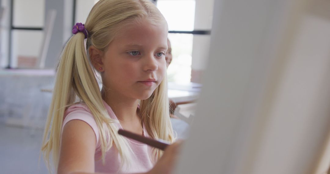 Young Girl Concentrating on Painting in Art Class - Free Images, Stock Photos and Pictures on Pikwizard.com