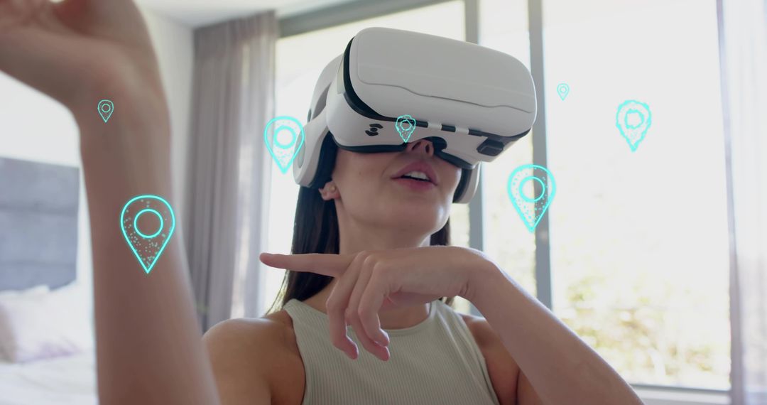 Young woman wearing VR headset gesturing in bedroom with augmented map-pin interface