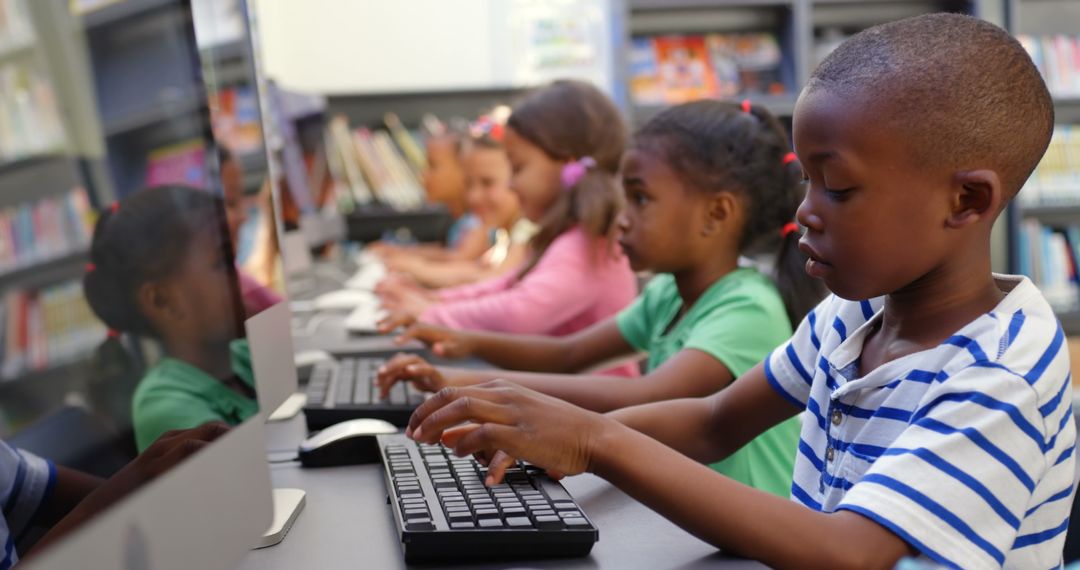 Young Diverse Students Engaging with Computers in Classroom