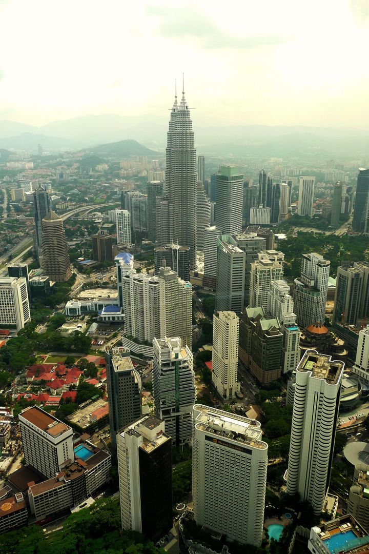 Aerial View of Downtown Kuala Lumpur with Iconic Petronas Towers - Free Images, Stock Photos and Pictures on Pikwizard.com