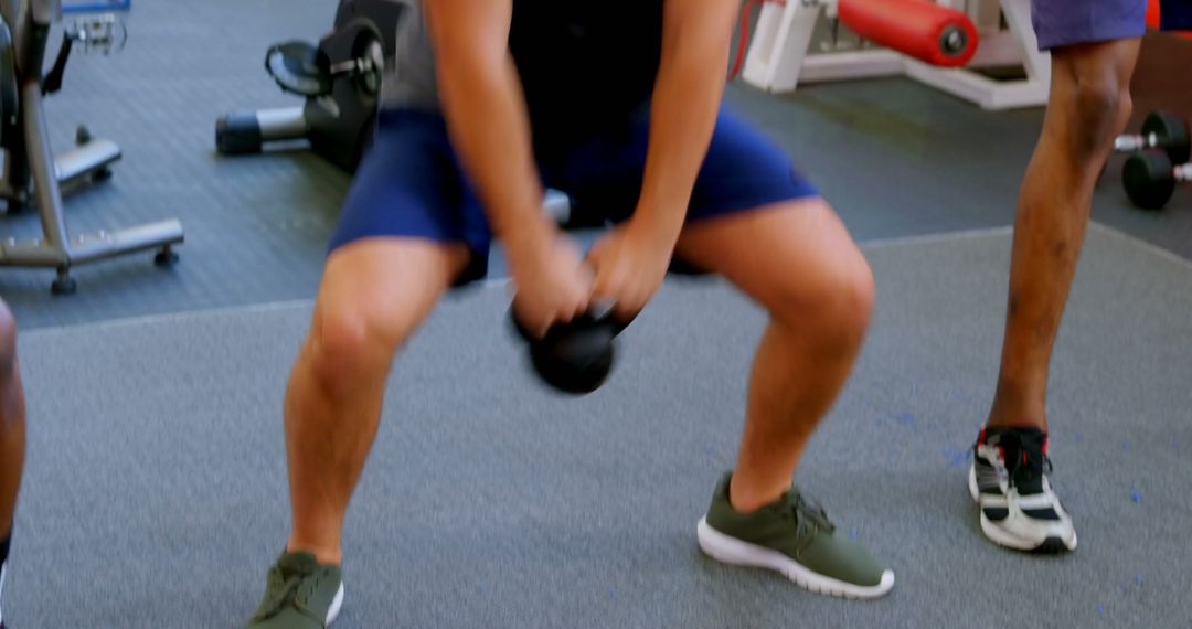 Men Exercising with Kettlebells in Gym - Free Images, Stock Photos and Pictures on Pikwizard.com