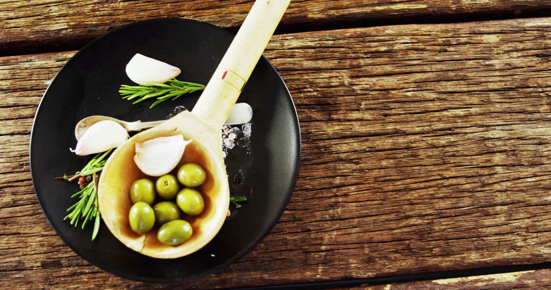 Mediterranean Olives and Garlic on Rustic Wooden Table - Free Images, Stock Photos and Pictures on Pikwizard.com