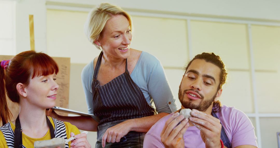 Diverse Adult Pottery Class with Hands-On Guidance