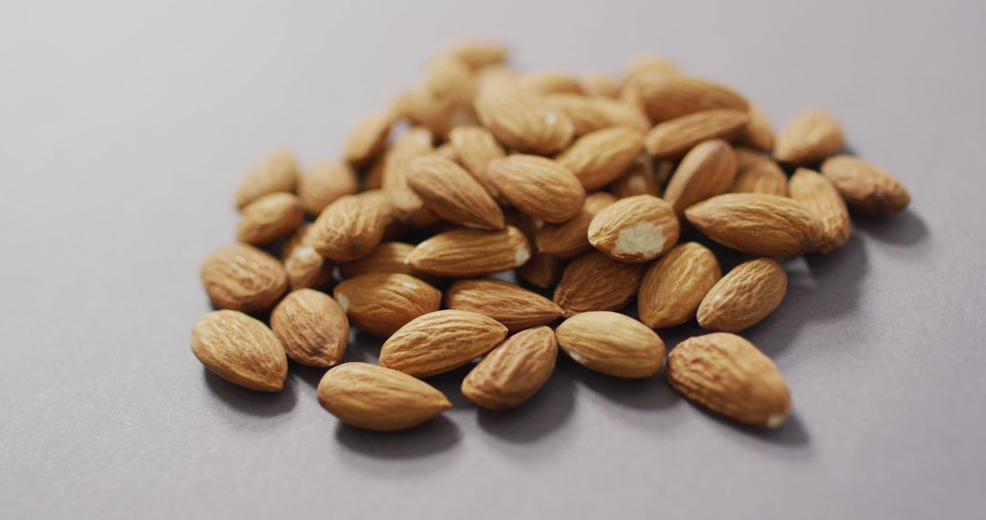 Raw Almonds on Grey Background Highlighting Healthy Eating