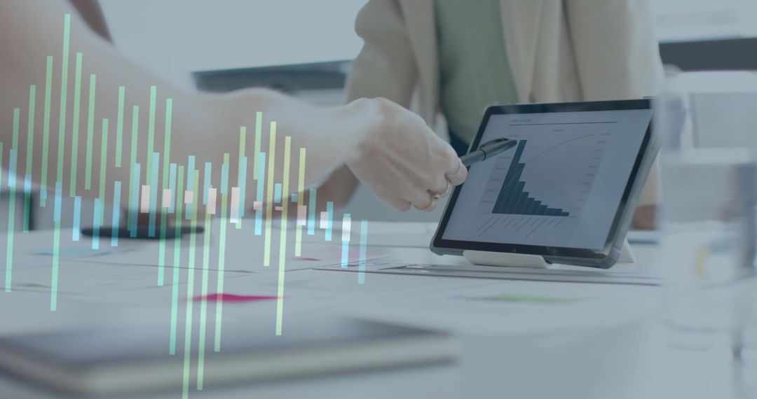 Business team analyzing financial data using digital tablet