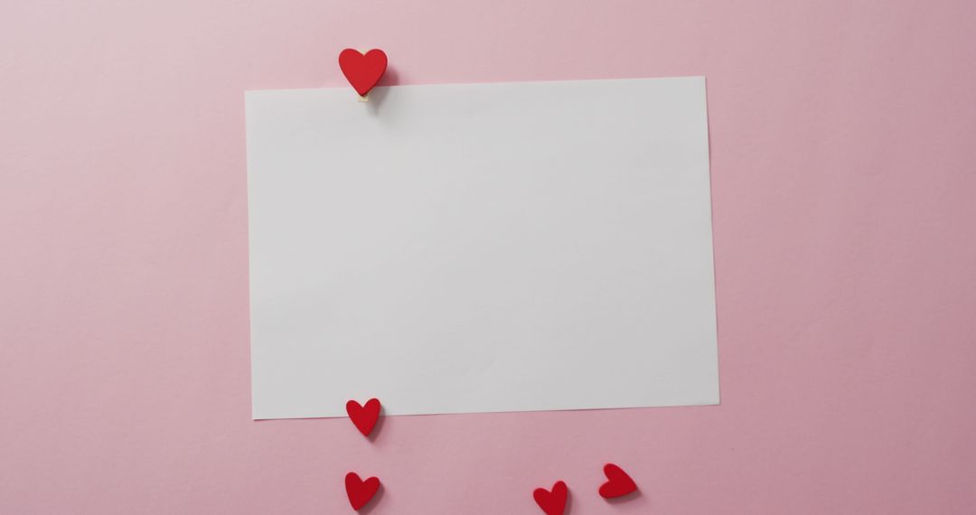 White Blank Card with Red Hearts on Pink Romantic Background