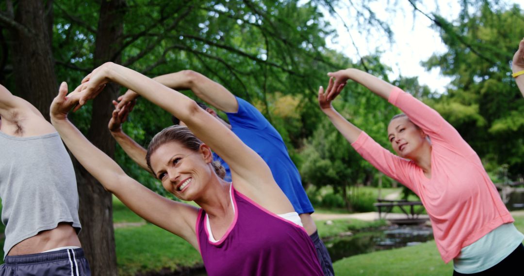 Group of Adults Practicing Outdoor Yoga in Park - Free Images, Stock Photos and Pictures on Pikwizard.com