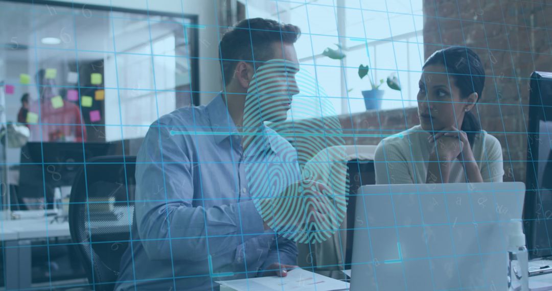 Colleagues Discussing Biometric Technology in Modern Office