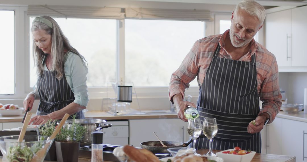 Middle-Aged Couple Enjoying Cooking and Wine at Home
