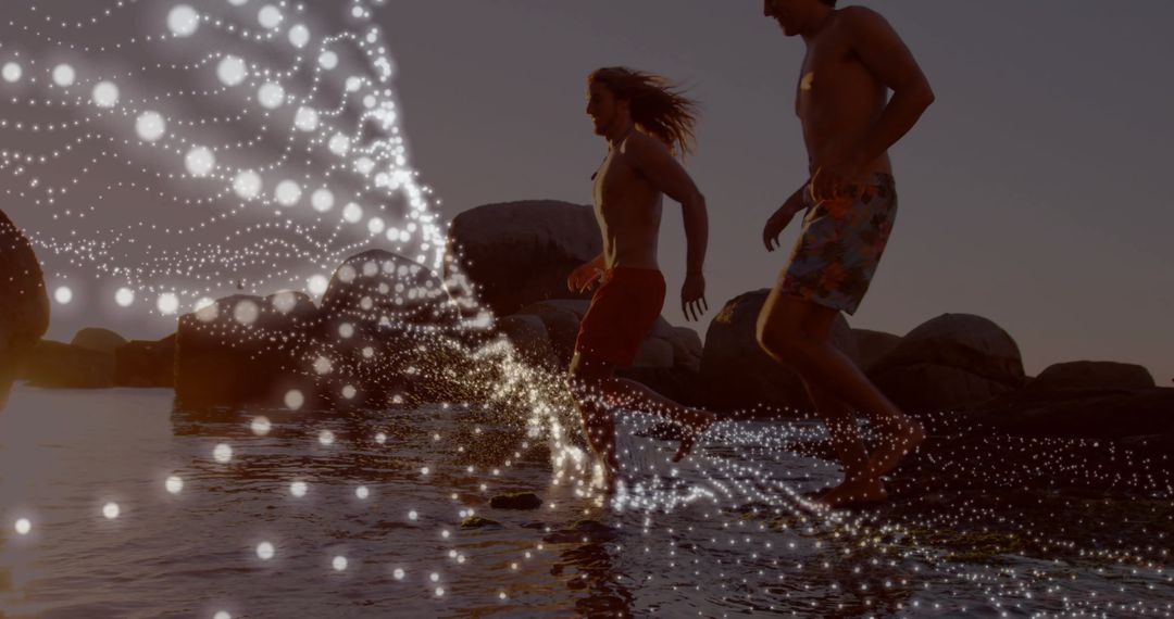 Young Adults Running on Beach with Glowing Particles Overlay