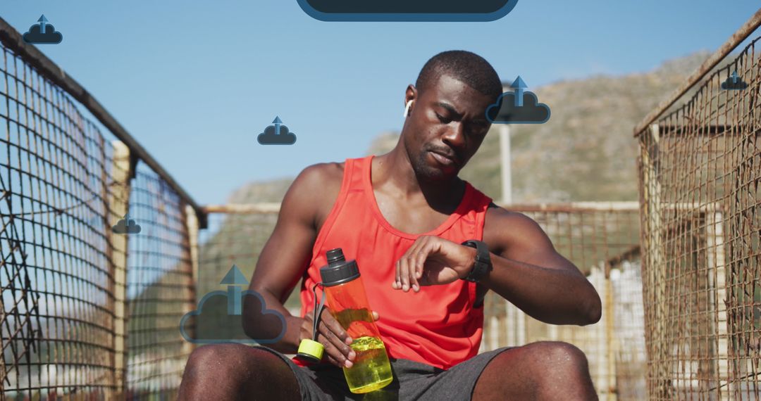 Athlete Taking Break Checking Fitness Stats with Cloud Technology
