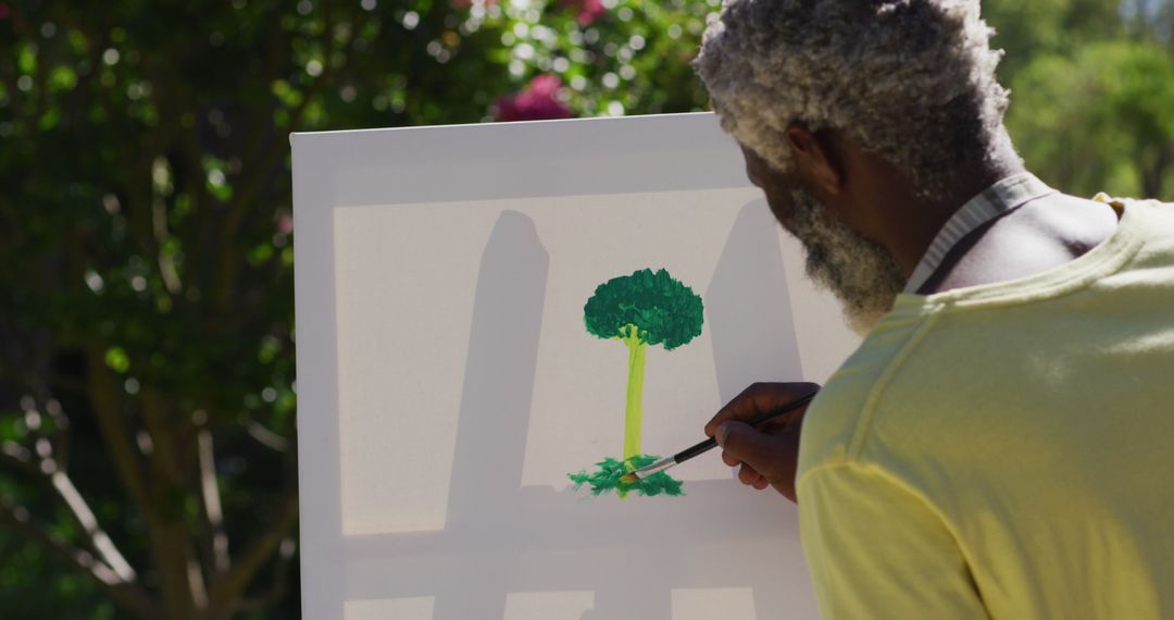 Senior Artist Painting Tree Outdoors in Natural Light - Free Images, Stock Photos and Pictures on Pikwizard.com