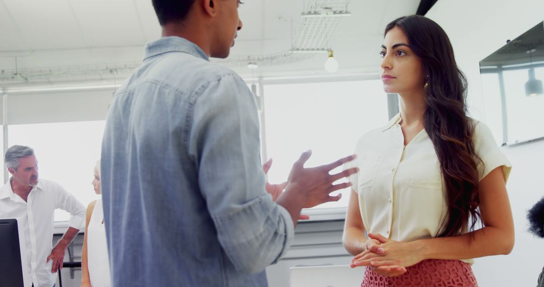 Diverse Team Discussion in Modern Office Space