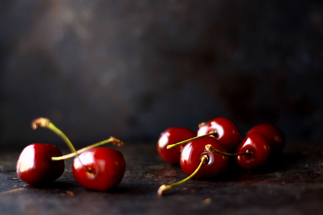 Ripe Red Cherries on Dark Rustic Background - Free Images, Stock Photos and Pictures on Pikwizard.com