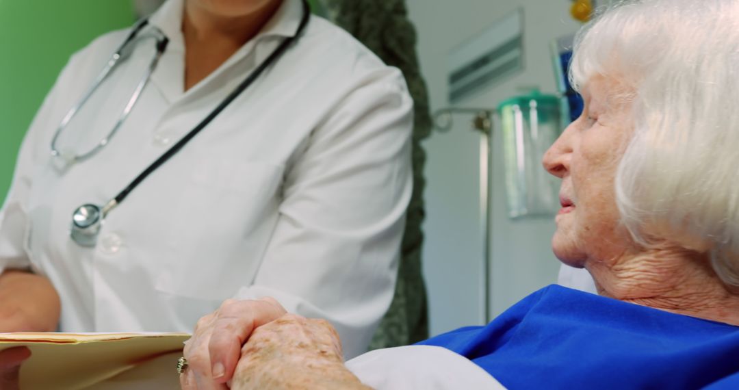 Elderly Patient Talking to Doctor in Hospital Room - Free Images, Stock Photos and Pictures on Pikwizard.com