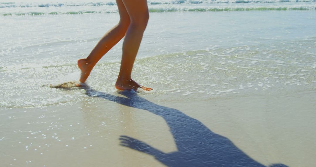 Close-up of Barefoot Woman Walking on Sandy Beach - Free Images, Stock Photos and Pictures on Pikwizard.com