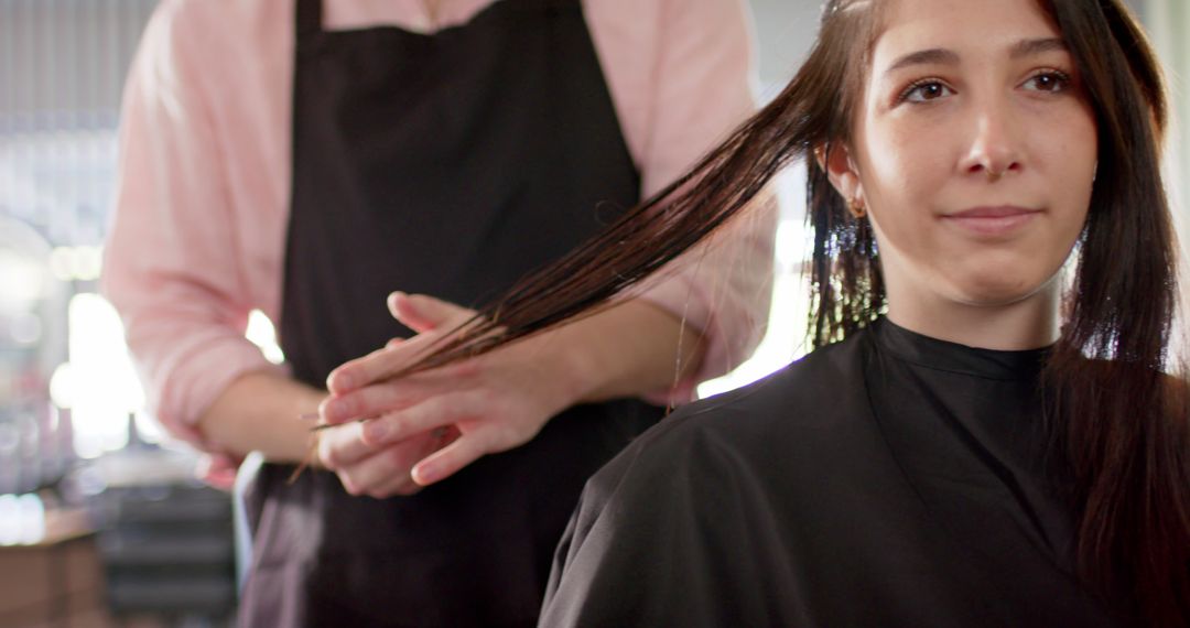 Stylist Cuts Long Hair of Smiling Woman in Salon - Free Images, Stock Photos and Pictures on Pikwizard.com