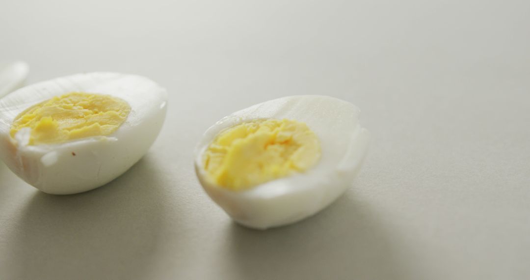 Sliced Hard-Boiled Egg Halves on White Background - Free Images, Stock Photos and Pictures on Pikwizard.com