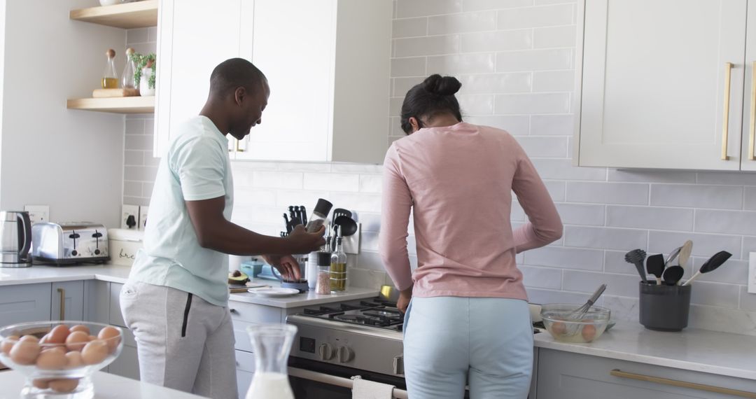 Couple Preparing Breakfast Together in Modern Kitchen