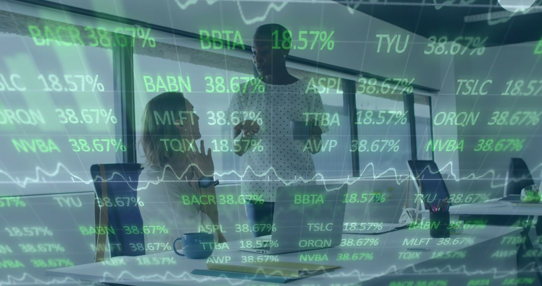 Diverse Businesswomen Discussing Stock Data in Modern Office