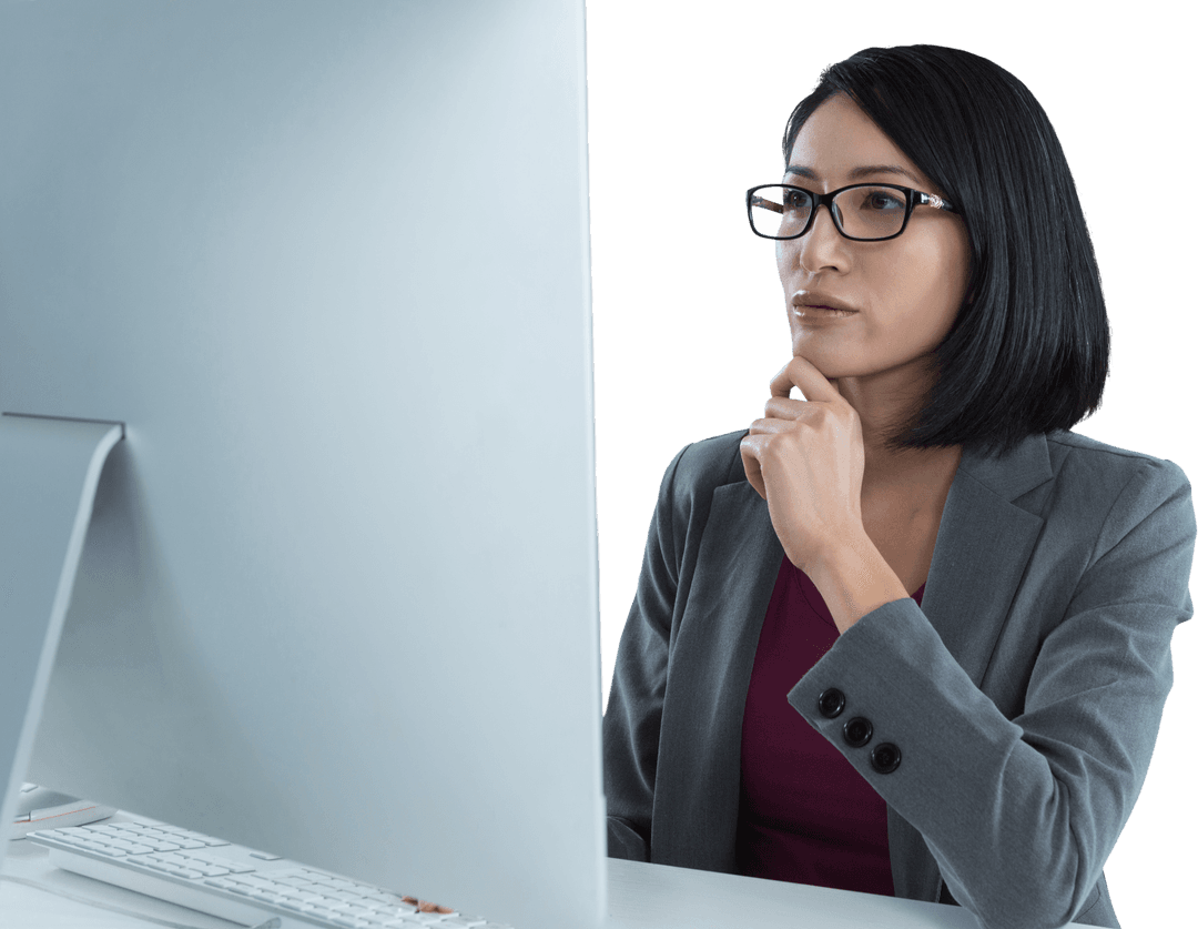 Transparent Asian Businesswoman Concentrated at Computer Desk