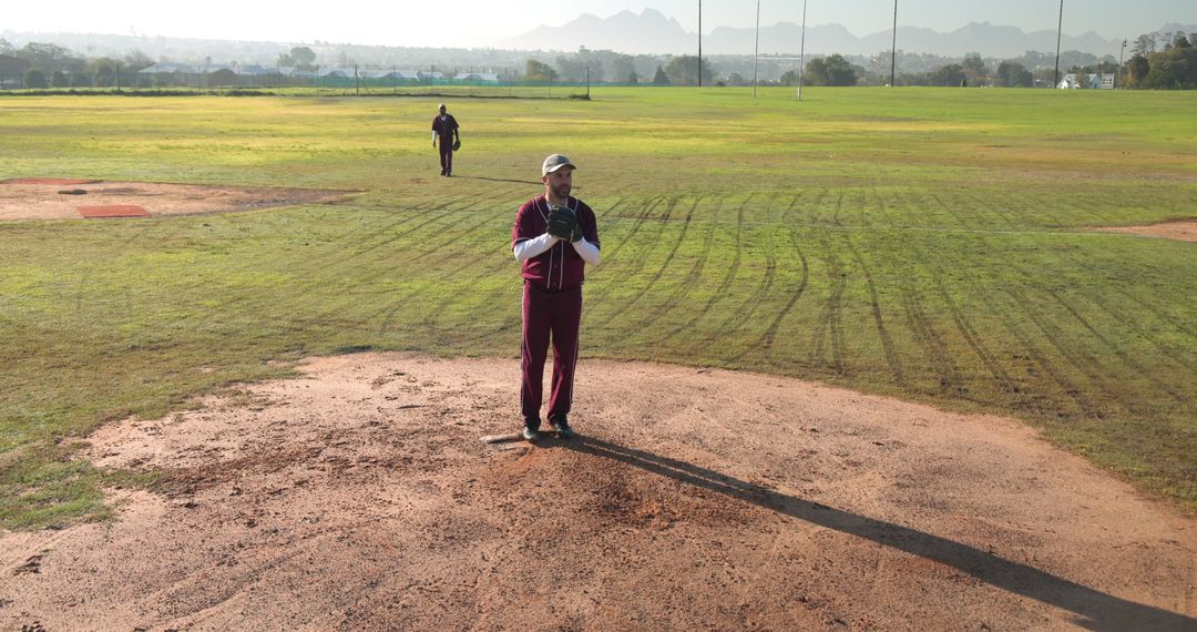 Baseball Player on Mound in Vintage Jersey by Field