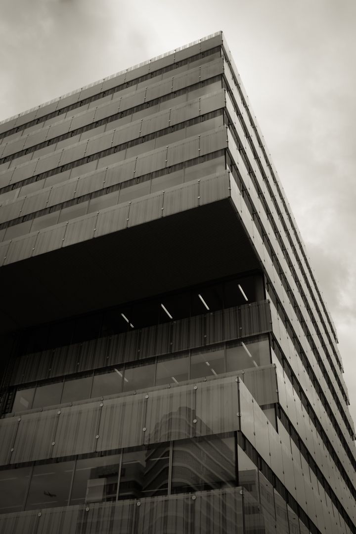 Modern Office Building with Glass Facade in Black and White - Free Images, Stock Photos and Pictures on Pikwizard.com
