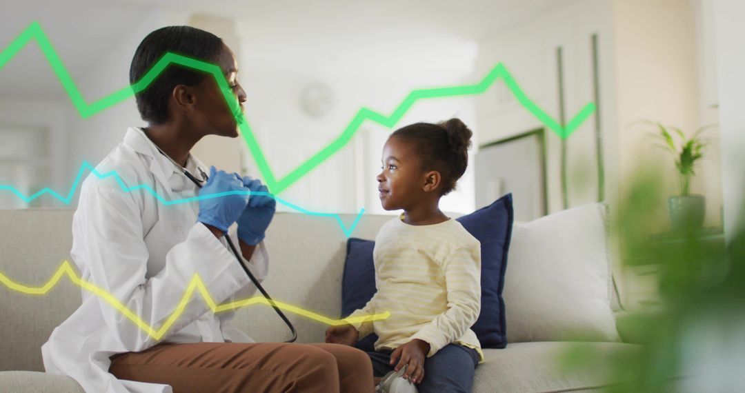 Black pediatrician listening to child heart during home visit with digital health graphs