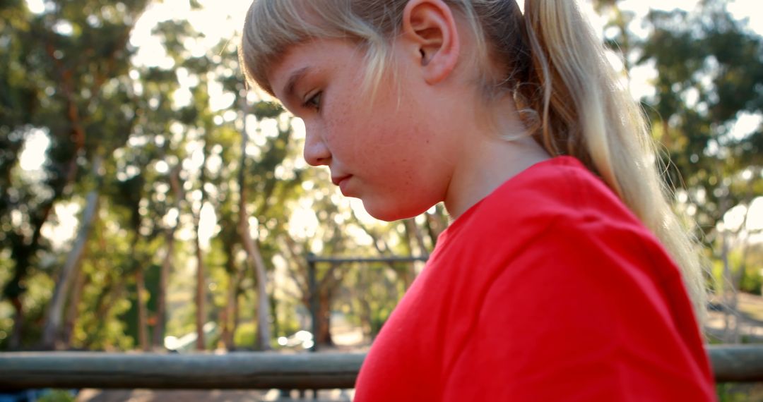 Young Girl Navigating Obstacle in Outdoor Boot Camp