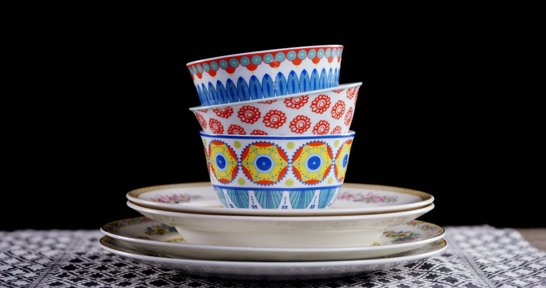Stacked Colorful Ceramic Bowls on Coordinating Plates