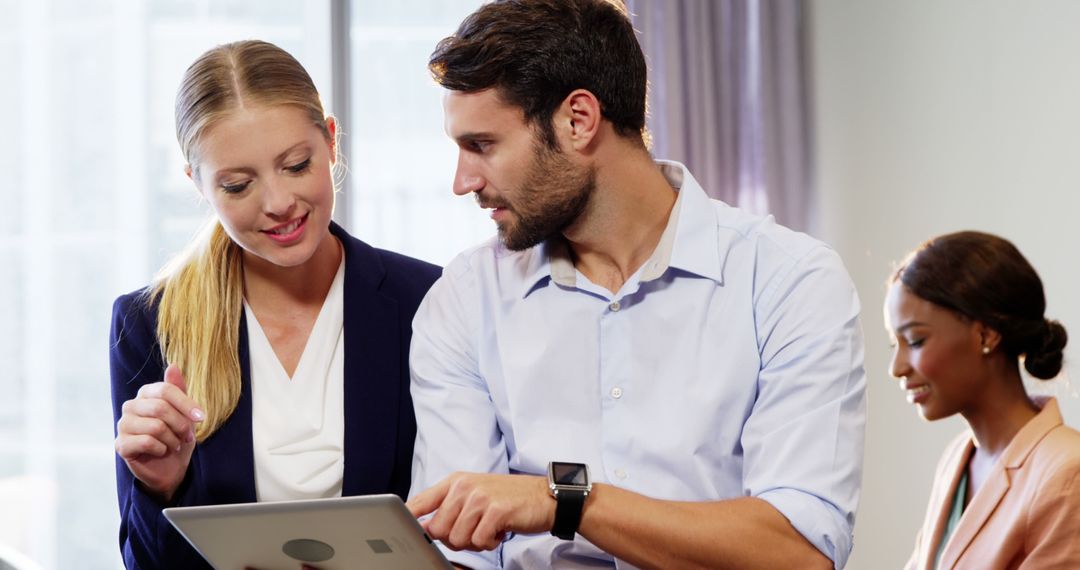 Collaborative Business Meeting with Digital Tablet in Modern Office